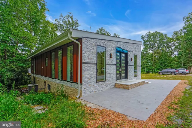 a view of park with large trees