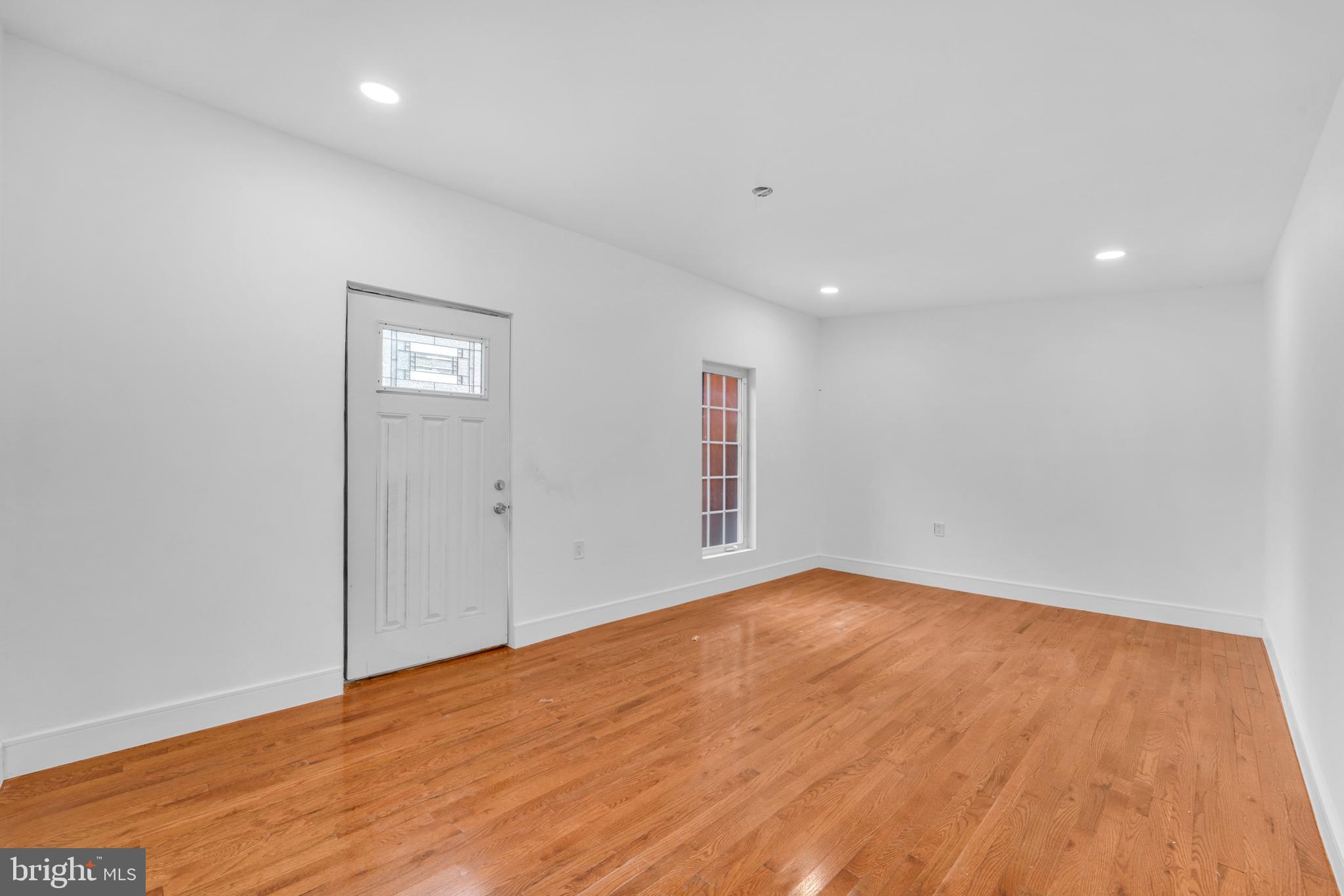 12116 Old Fort Road Fort Washington, MD 20744 - Photo 42 of 65 an empty room with wooden floor and windows