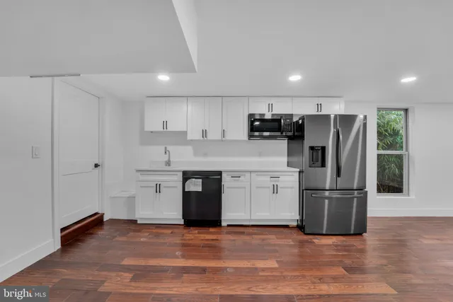 a view of a tall building with a yard