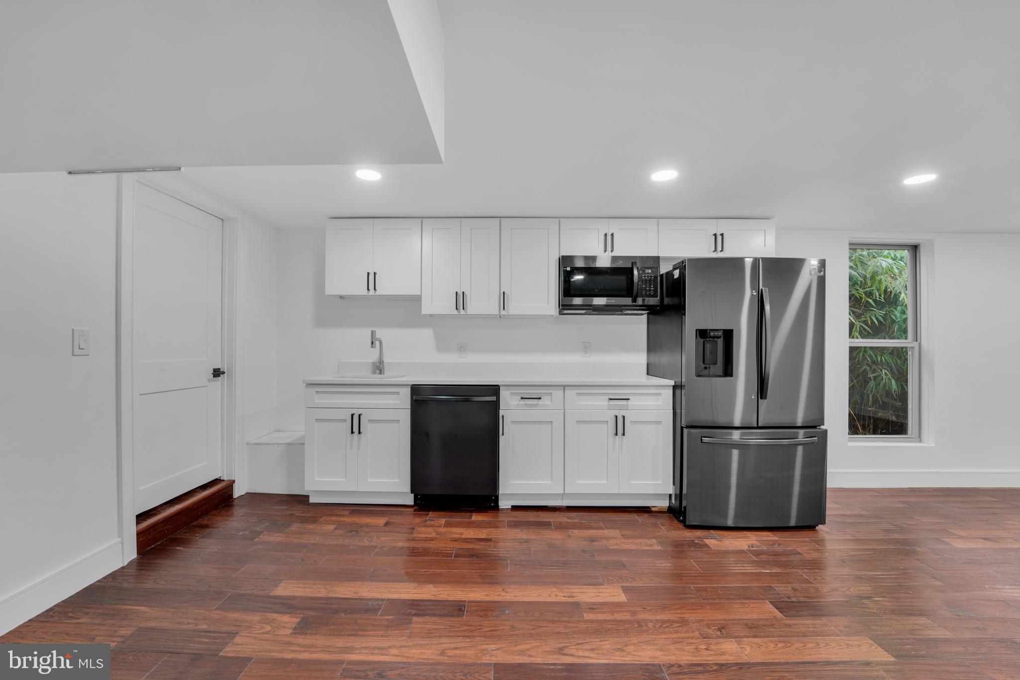 12116 Old Fort Road Fort Washington, MD 20744 - Photo 51 of 65 a kitchen with stainless steel appliances granite countertop a refrigerator sink and cabinets