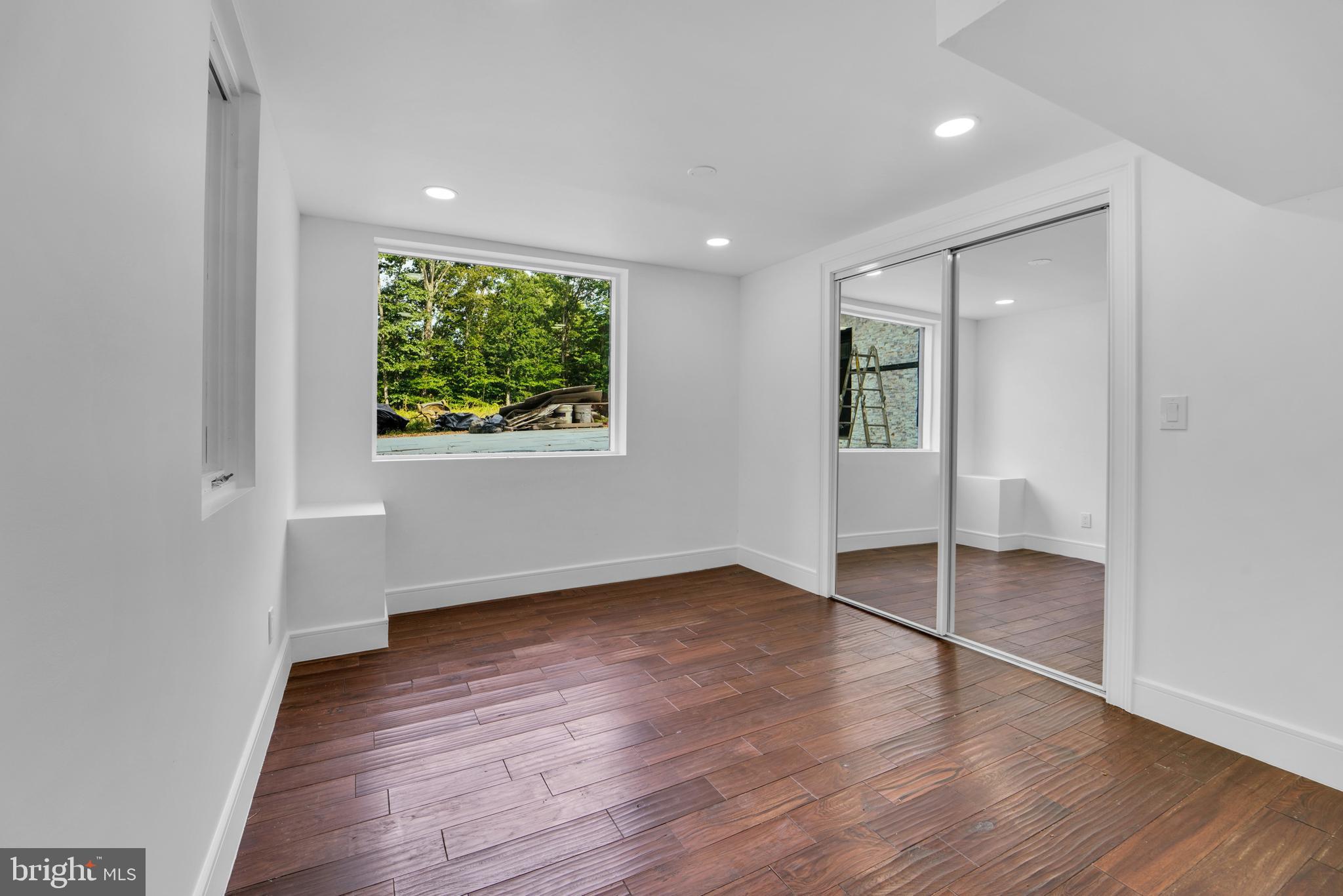 12116 Old Fort Road Fort Washington, MD 20744 - Photo 56 of 65 an empty room with wooden floor and windows