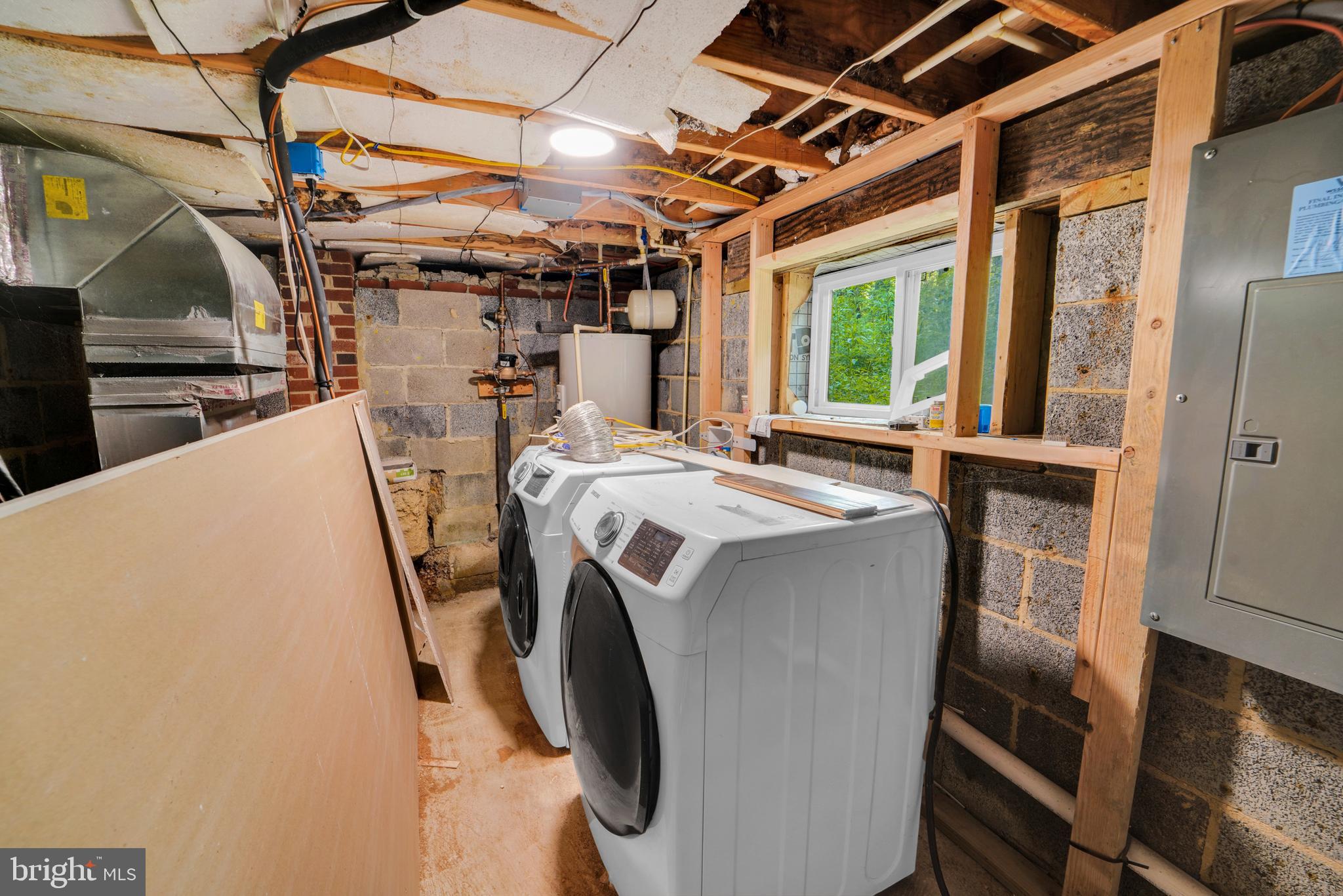 12116 Old Fort Road Fort Washington, MD 20744 - Photo 60 of 65 a view of a storage & utility room with washer and dryer