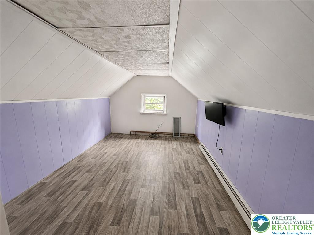 3540 Mountain Road, Unit 3538 Slatington, PA 18080 - Photo 13 of 27 Angled ceilings and durable plank flooring define this versatile upper-level bonus space.