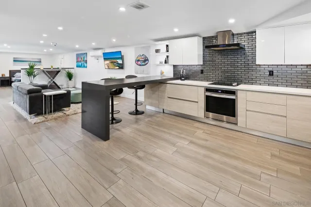 a kitchen with a sink cabinets and window