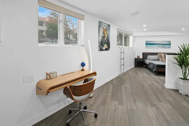 a room with furniture and wooden floor