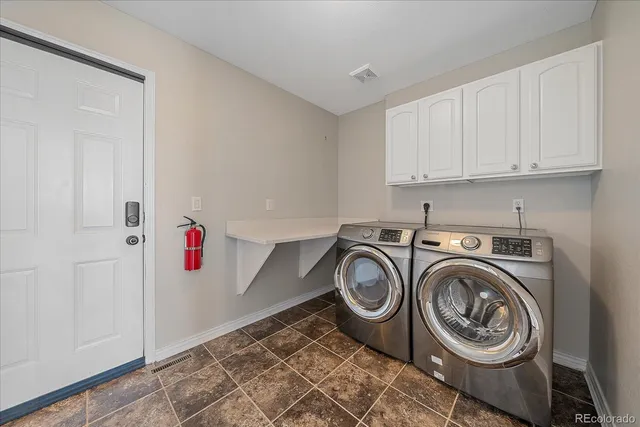 a storage room with washer and dryer