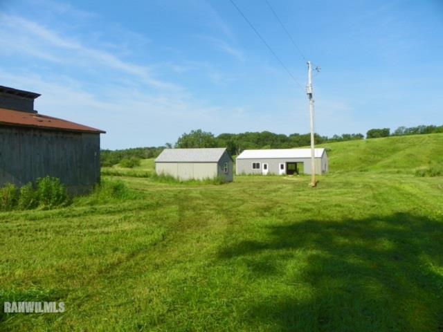17658 Scenic Ridge Road Savanna, IL 61074 - Photo 3 of 24 a view of a garden with an outdoor space
