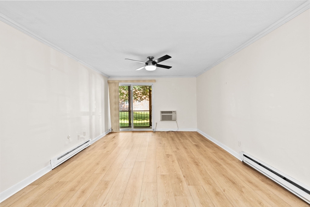 79 Fountain Lane, Unit 3 Weymouth, MA 02190 - Photo 11 of 29 wooden floor in an empty room with a window