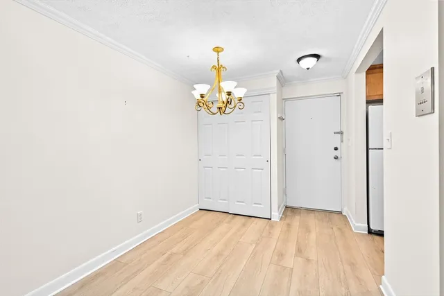 a view of an entryway with wooden floor