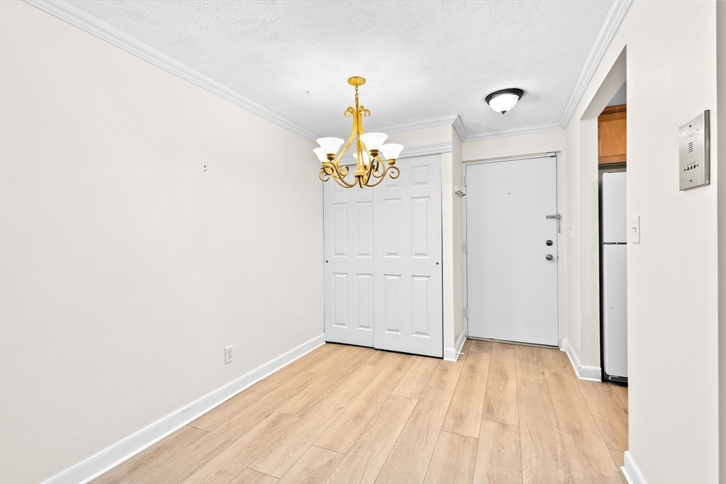 79 Fountain Lane, Unit 3 Weymouth, MA 02190 - Photo 13 of 29 a view of an entryway with wooden floor