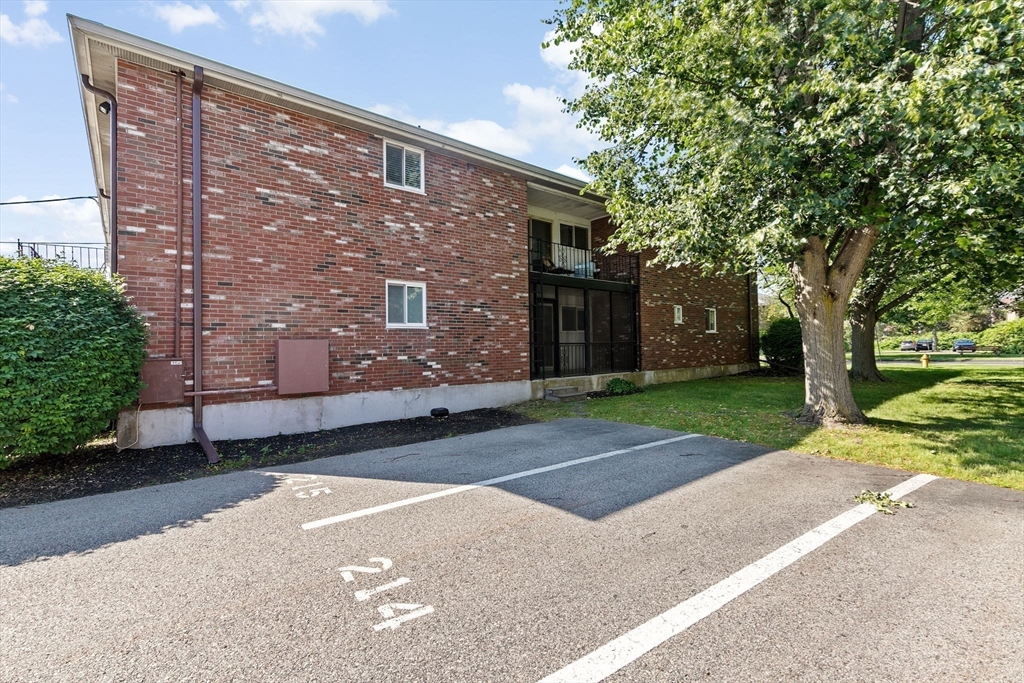 79 Fountain Lane, Unit 3 Weymouth, MA 02190 - Photo 20 of 29 a brick building with a tree in front of it