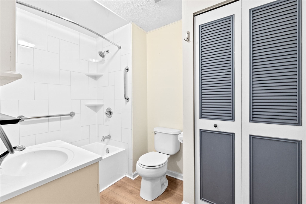 79 Fountain Lane, Unit 3 Weymouth, MA 02190 - Photo 21 of 29 a bathroom with a sink a toilet and shower