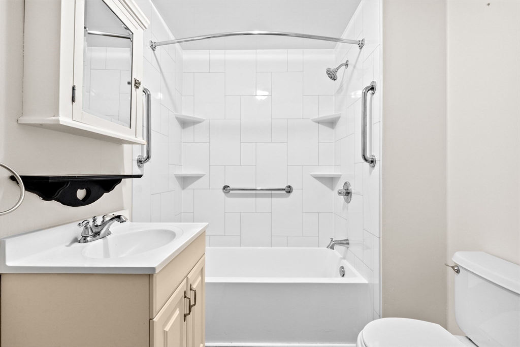 79 Fountain Lane, Unit 3 Weymouth, MA 02190 - Photo 23 of 29 a bathroom with a sink toilet and shower