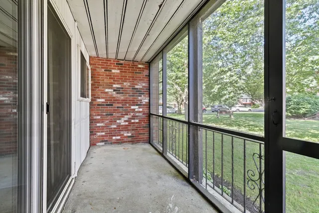 a view of a porch with wooden floor and outdoor space