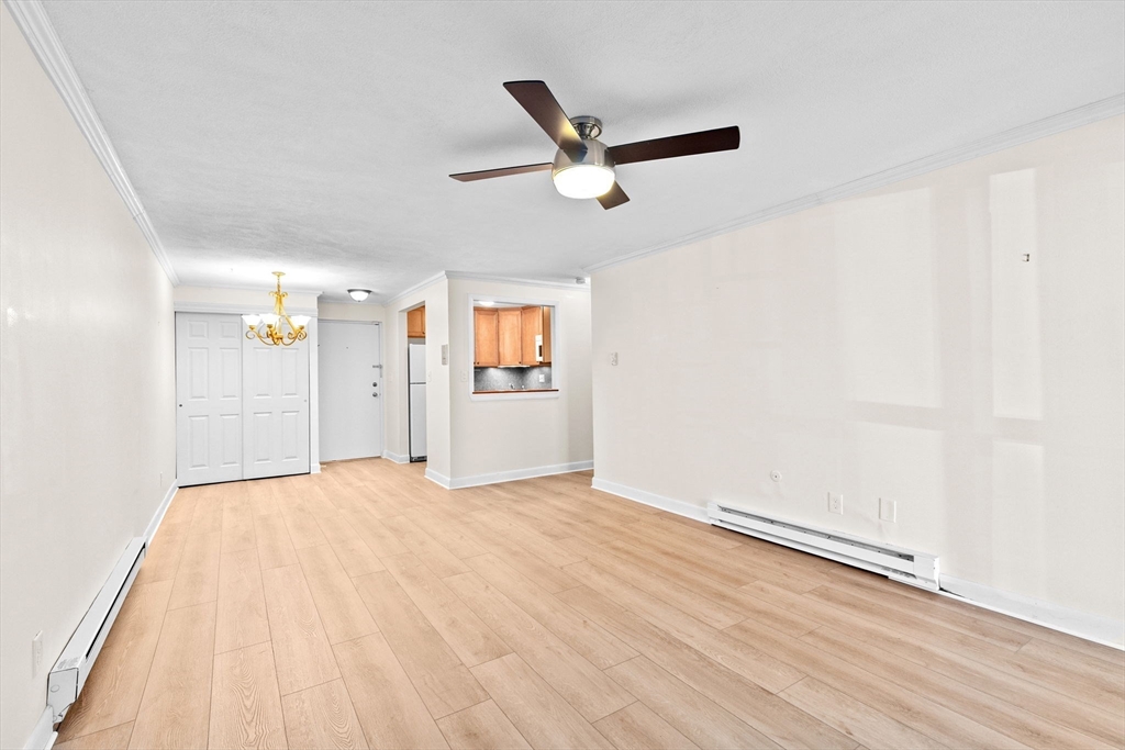 79 Fountain Lane, Unit 3 Weymouth, MA 02190 - Photo 9 of 29 wooden floor in an empty room