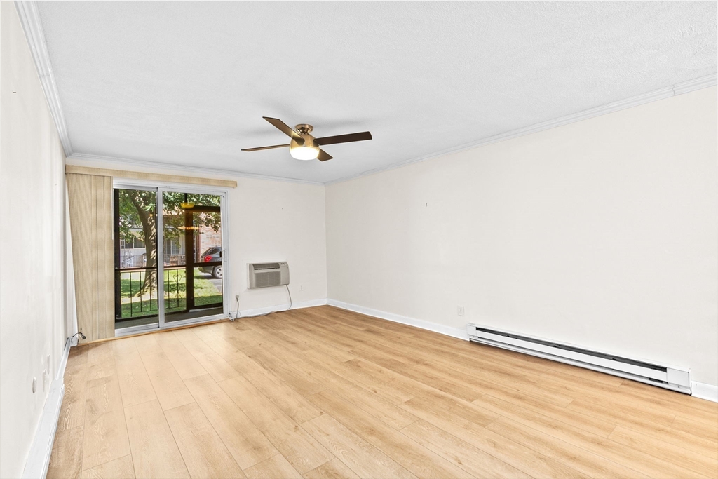 79 Fountain Lane, Unit 3 Weymouth, MA 02190 - Photo 10 of 29 a view of a livingroom with a ceiling fan and window
