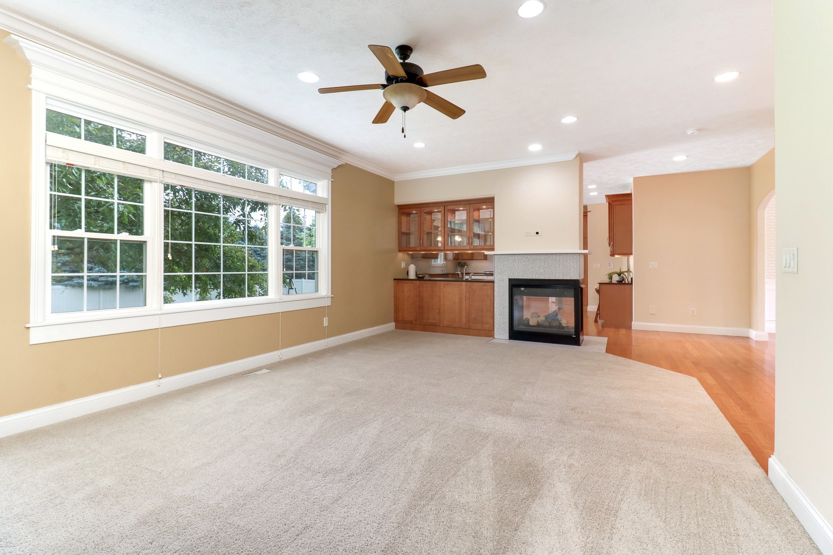 69 Brookstone Circle Bloomington, IL 61704 - Photo 14 of 63 a view of work and kitchen with furniture ceiling fan and window