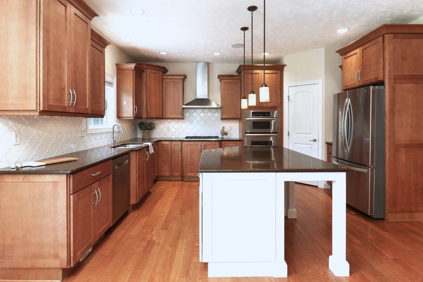 69 Brookstone Circle Bloomington, IL 61704 - Photo 20 of 63 a kitchen with stainless steel appliances granite countertop a refrigerator a sink a stove and oven