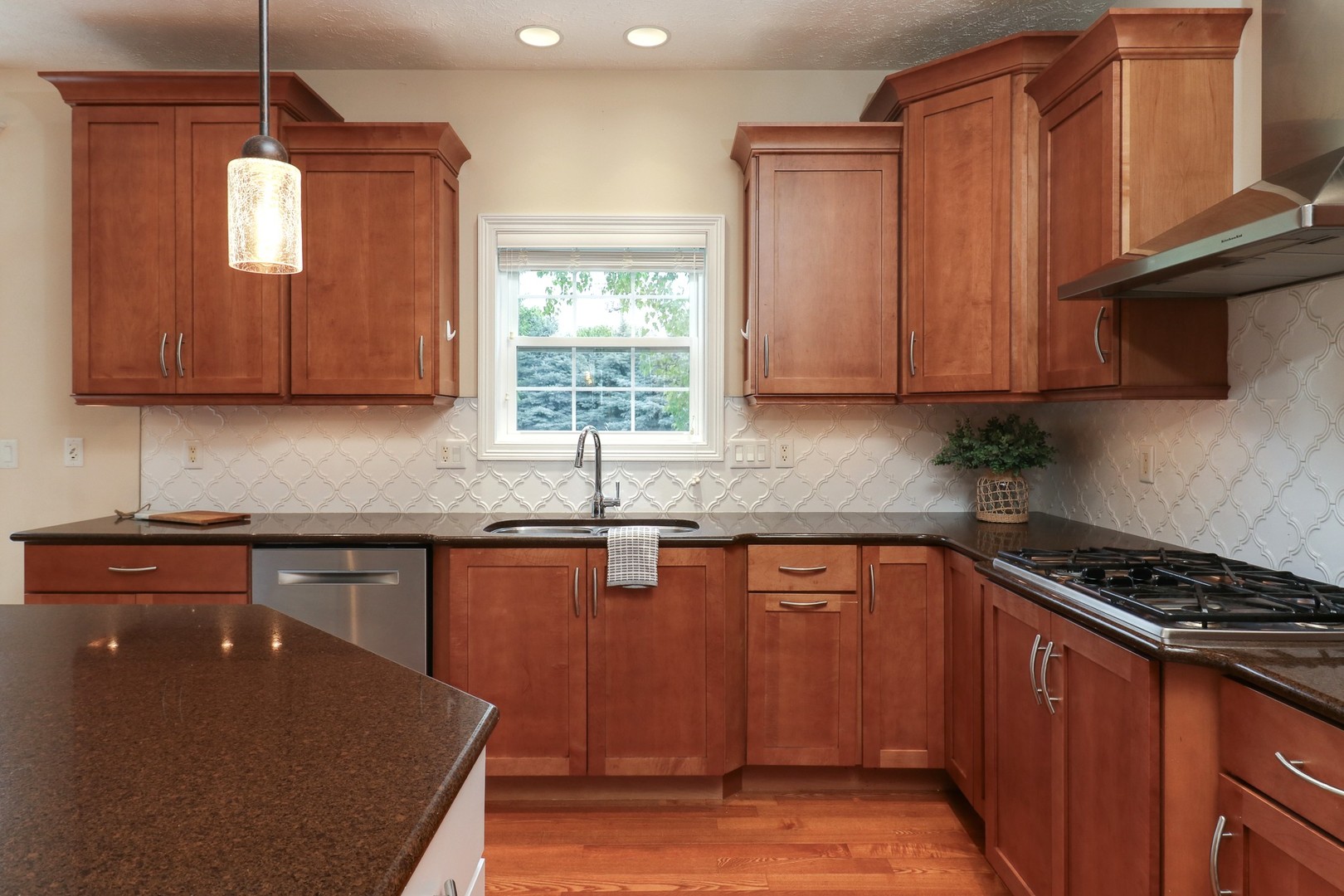 69 Brookstone Circle Bloomington, IL 61704 - Photo 22 of 63 a kitchen with granite countertop cabinets stainless steel appliances a window and a counter space