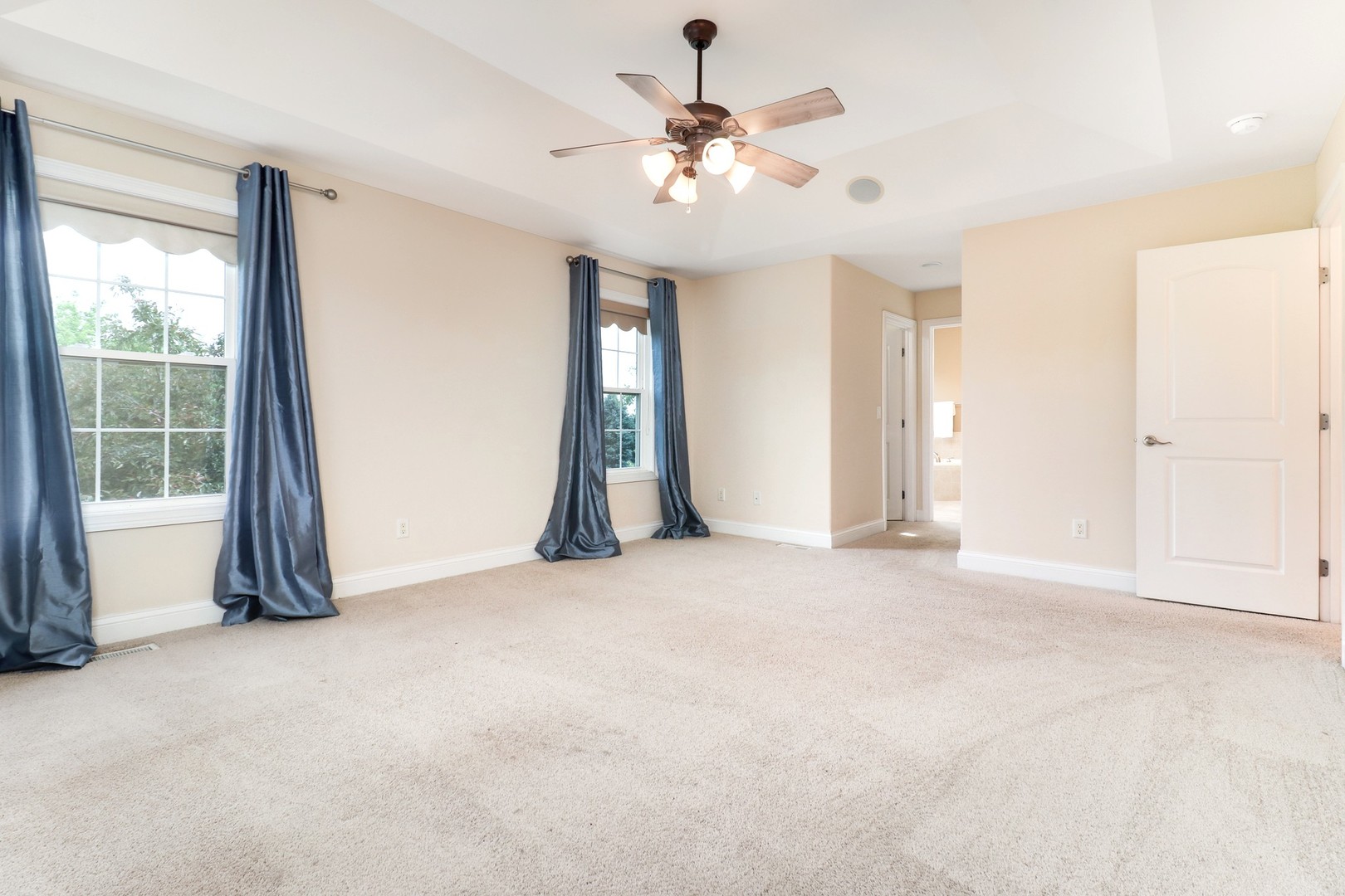 69 Brookstone Circle Bloomington, IL 61704 - Photo 31 of 63 an empty room with windows and fan