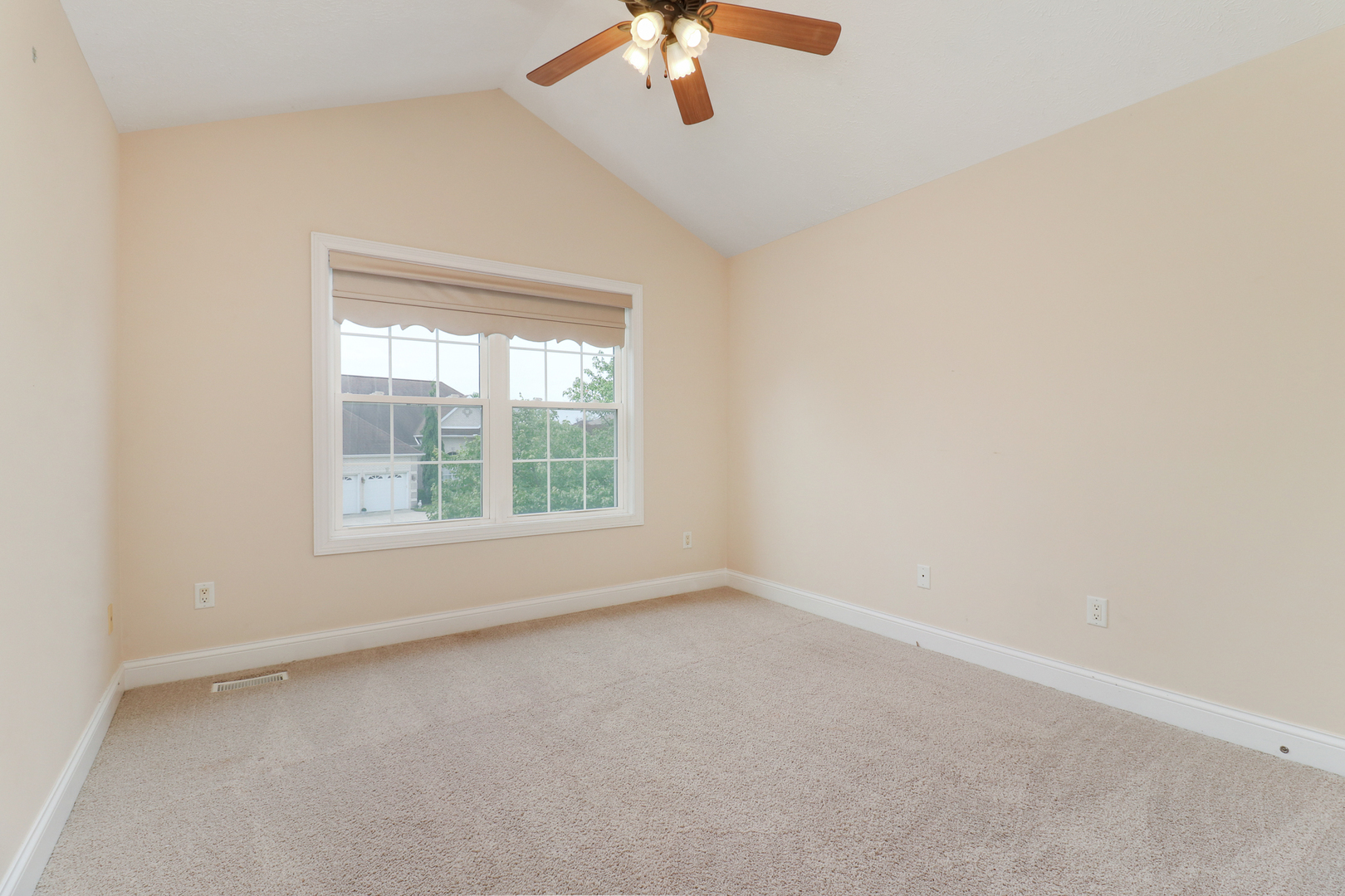 69 Brookstone Circle Bloomington, IL 61704 - Photo 35 of 63 a view of a livingroom with a ceiling fan and window