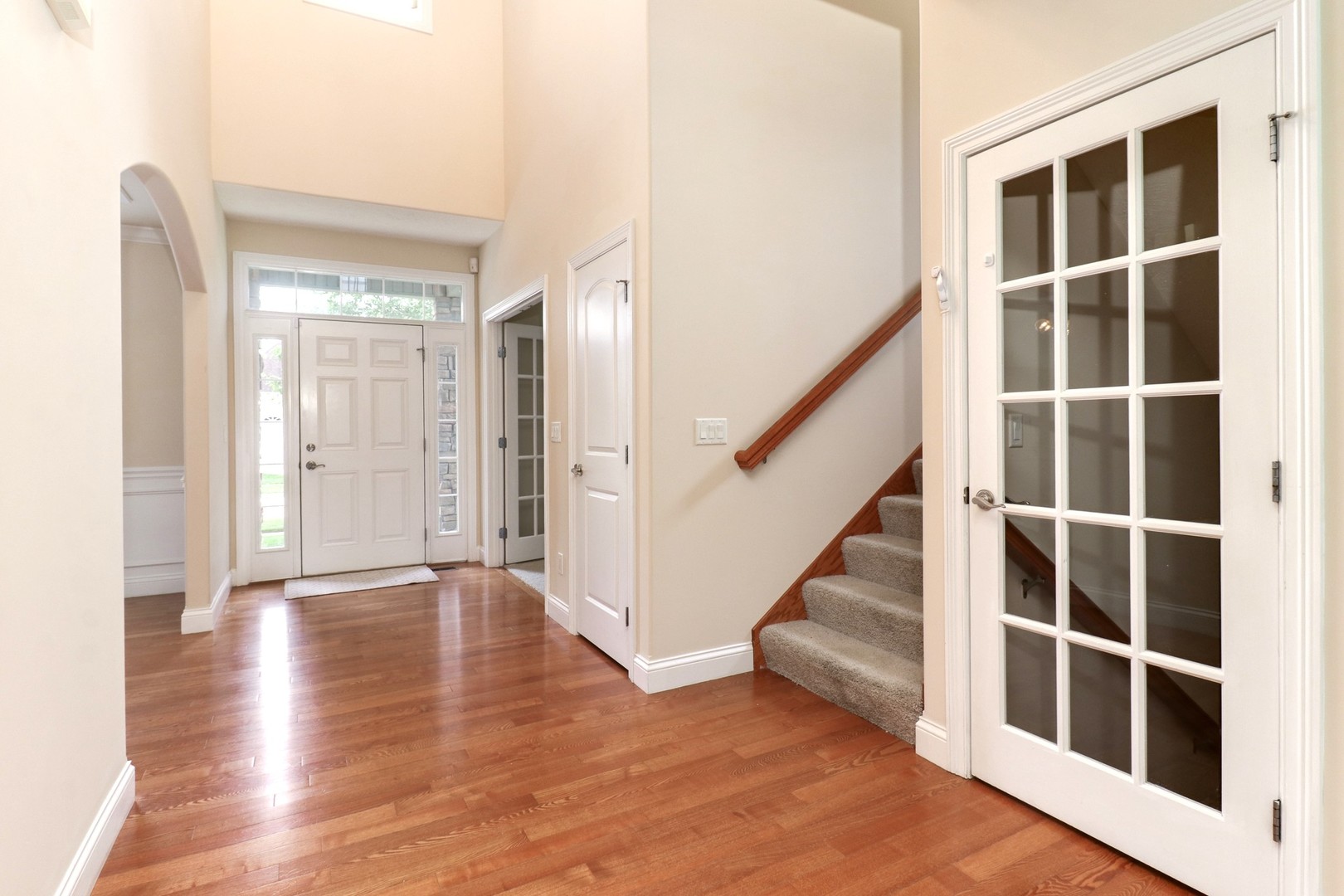 69 Brookstone Circle Bloomington, IL 61704 - Photo 42 of 63 a view of an empty room with wooden floor and windows
