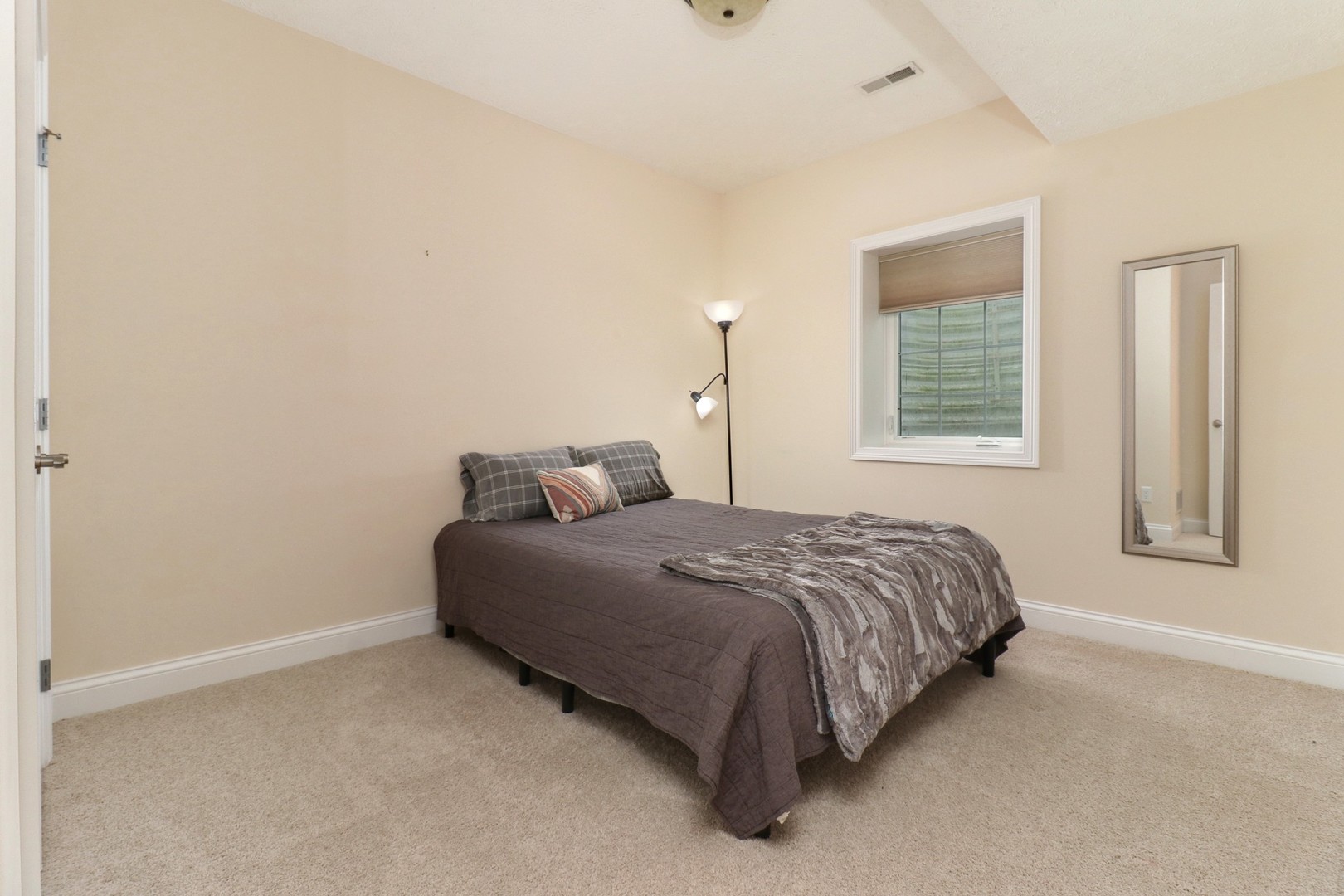 69 Brookstone Circle Bloomington, IL 61704 - Photo 51 of 63 a bedroom with a bed and a window