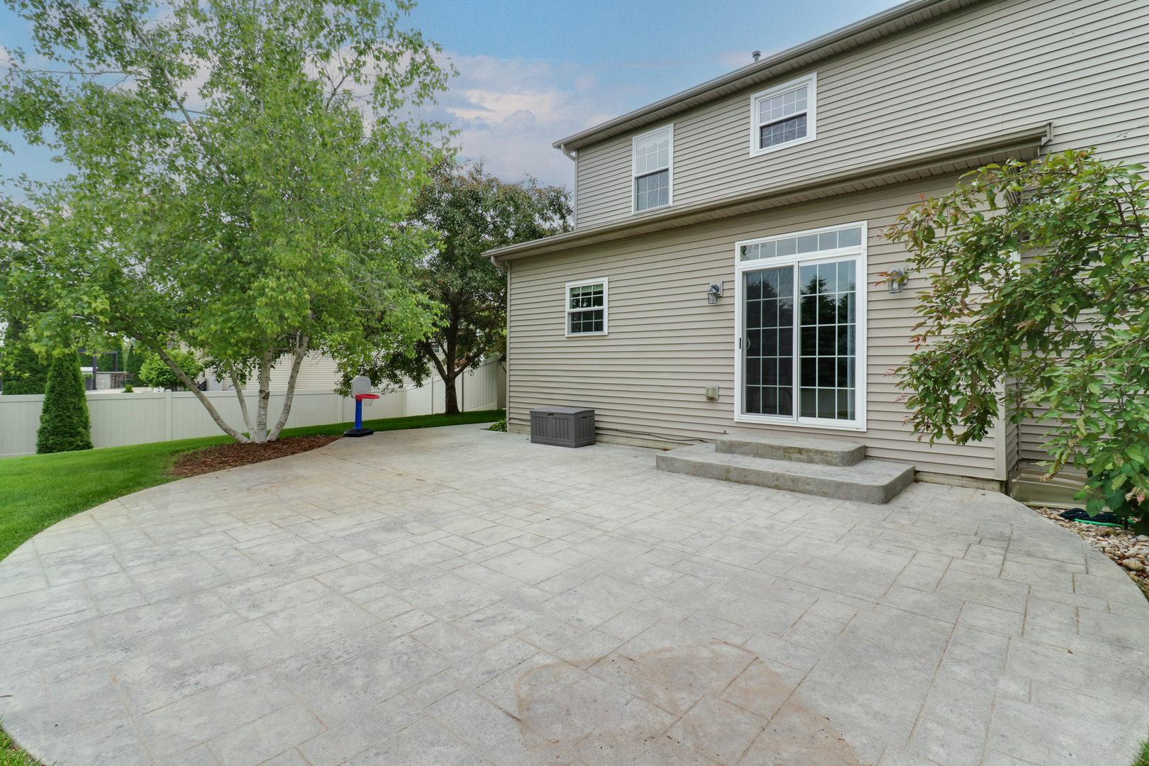 69 Brookstone Circle Bloomington, IL 61704 - Photo 56 of 63 a view of a house with a yard and garage