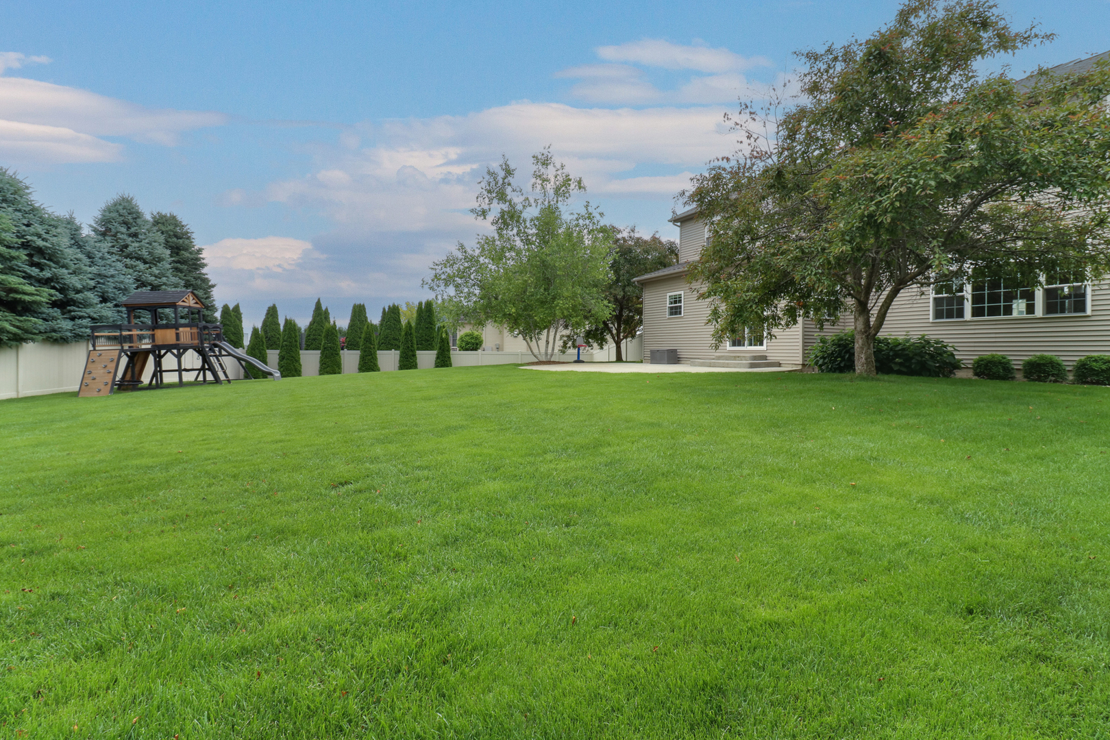 69 Brookstone Circle Bloomington, IL 61704 - Photo 61 of 63 a view of a park with a house in the background