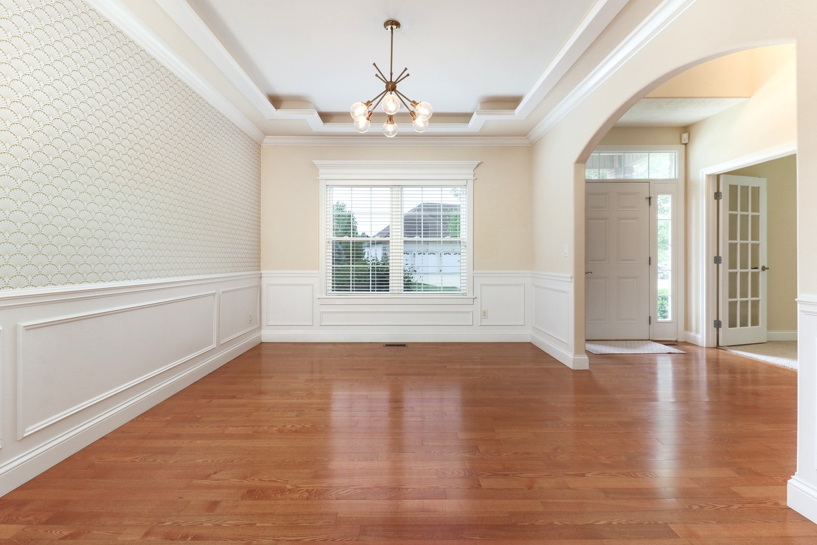 69 Brookstone Circle Bloomington, IL 61704 - Photo 8 of 63 a view of an empty room with wooden floor and a window