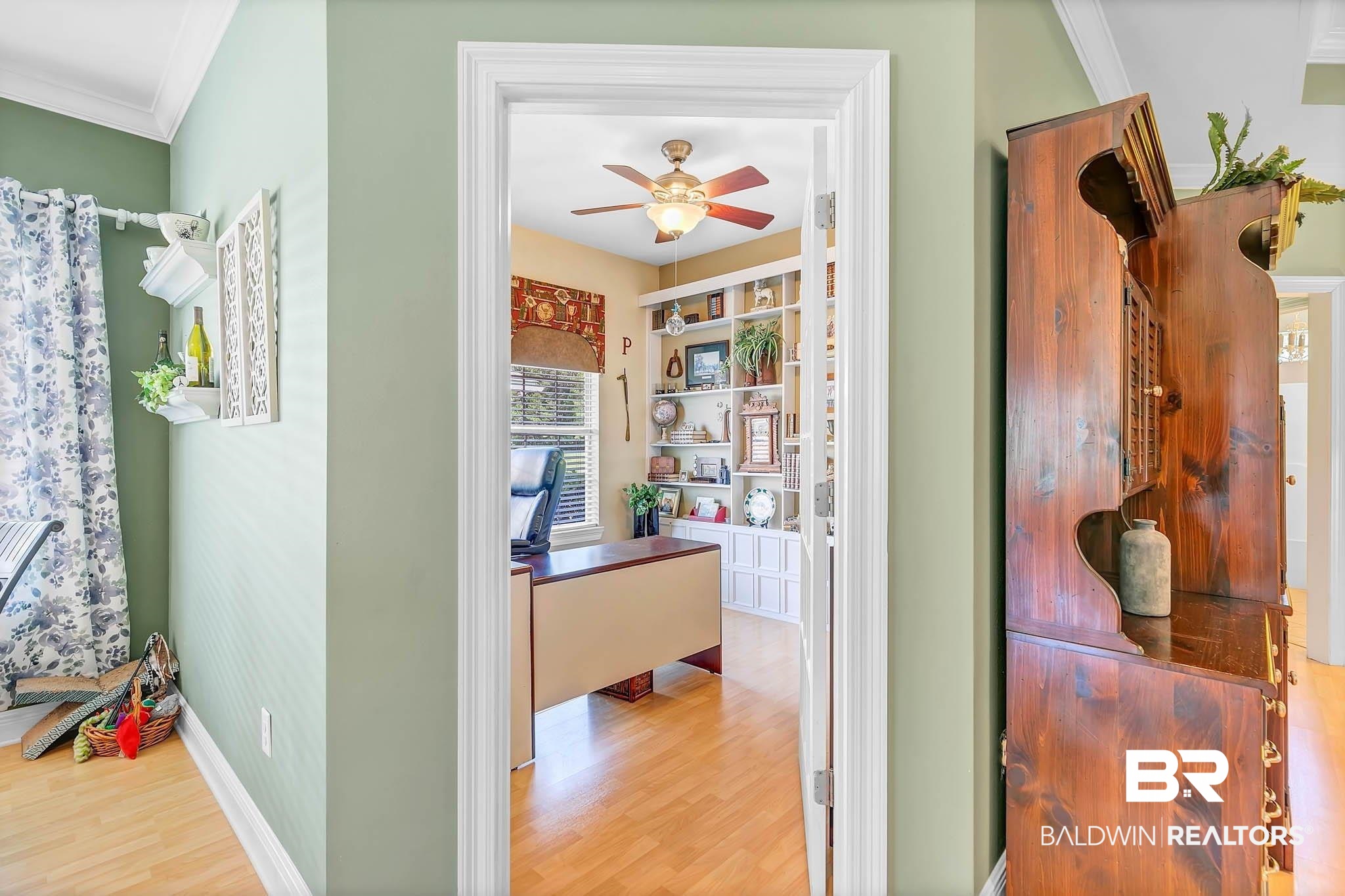 213 Hemingway Loop Foley, AL 36535 - Photo 37 of 69 Corridor featuring wood finished floors, crown molding, and a desk