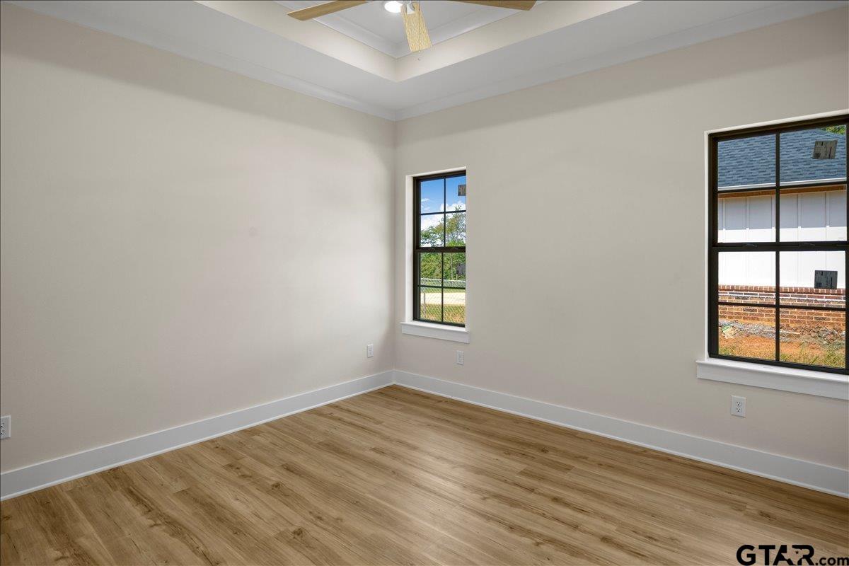 501 County Road 330 Tyler, TX 75708 - Photo 25 of 36 an empty room with wooden floor and windows
