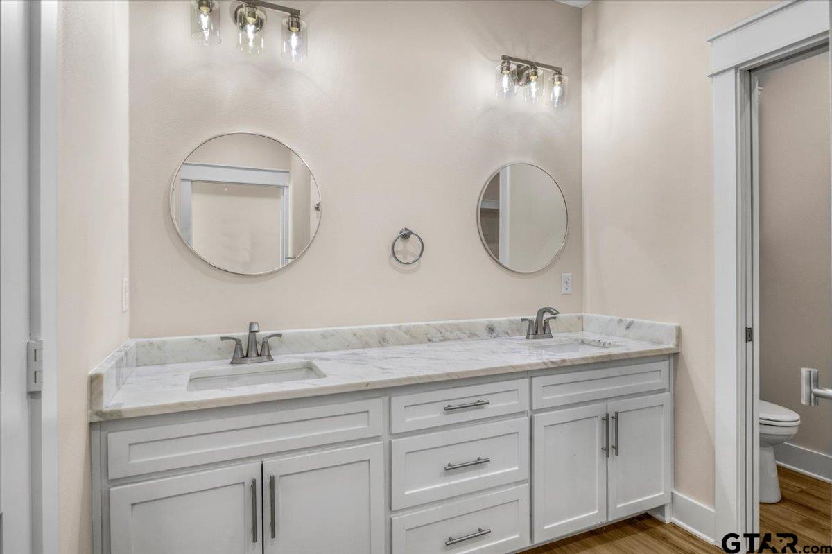 501 County Road 330 Tyler, TX 75708 - Photo 30 of 36 a bathroom with a double vanity sink and a mirror