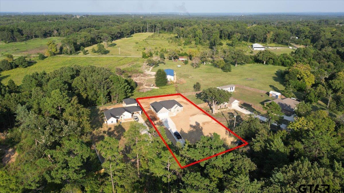 501 County Road 330 Tyler, TX 75708 - Photo 35 of 36 an aerial view of residential houses with outdoor space and trees