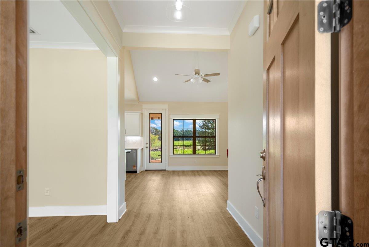 501 County Road 330 Tyler, TX 75708 - Photo 6 of 36 a view of an empty room with wooden floor and a window