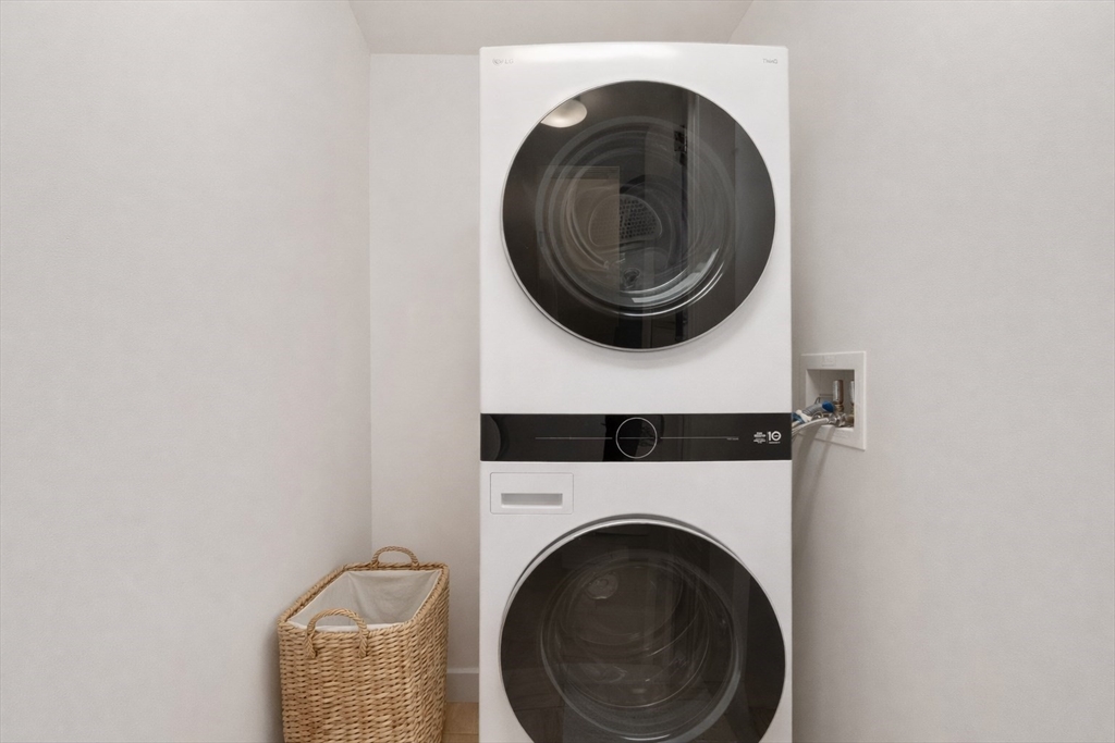 1 Franklin Street, Unit 1602 Boston, MA 02110 - Photo 9 of 14 a utility room with dryer and washer