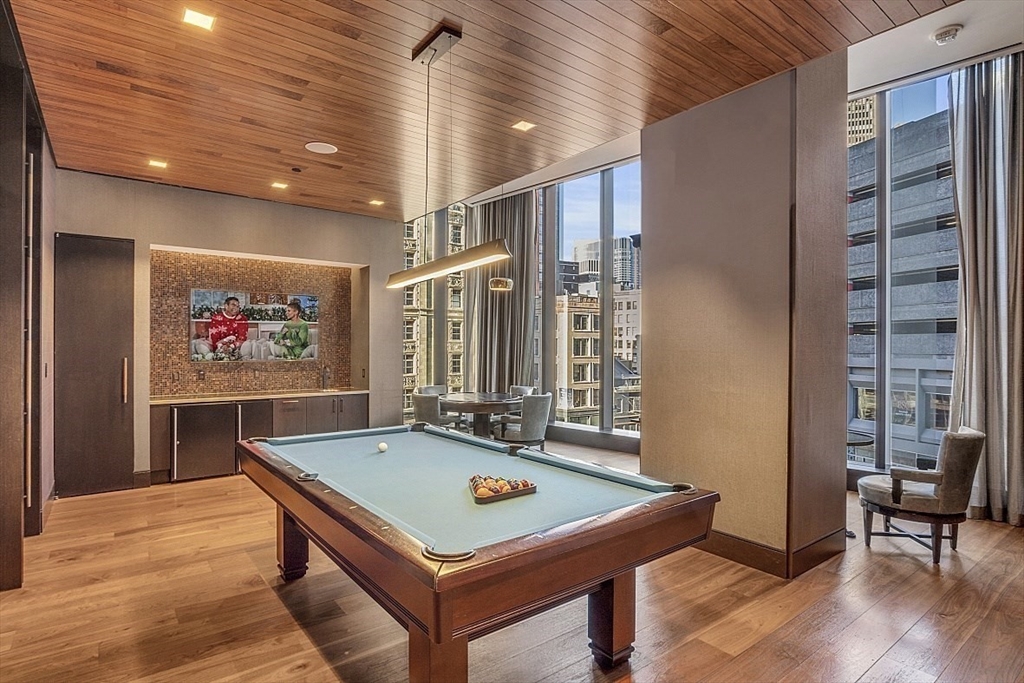 1 Franklin Street, Unit 1602 Boston, MA 02110 - Photo 10 of 14 a room with pool table and windows