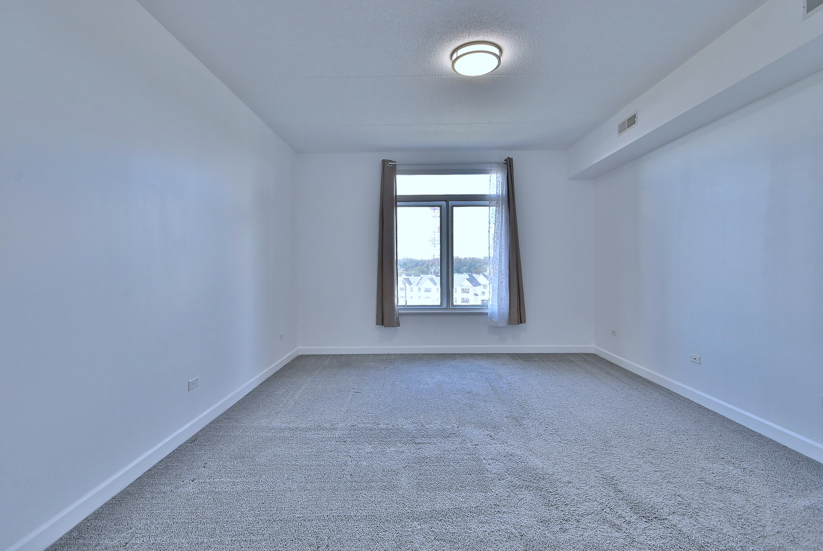 8300 Callie Avenue, Unit 412 Morton Grove, IL 60053 - Photo 12 of 28 an empty room with windows