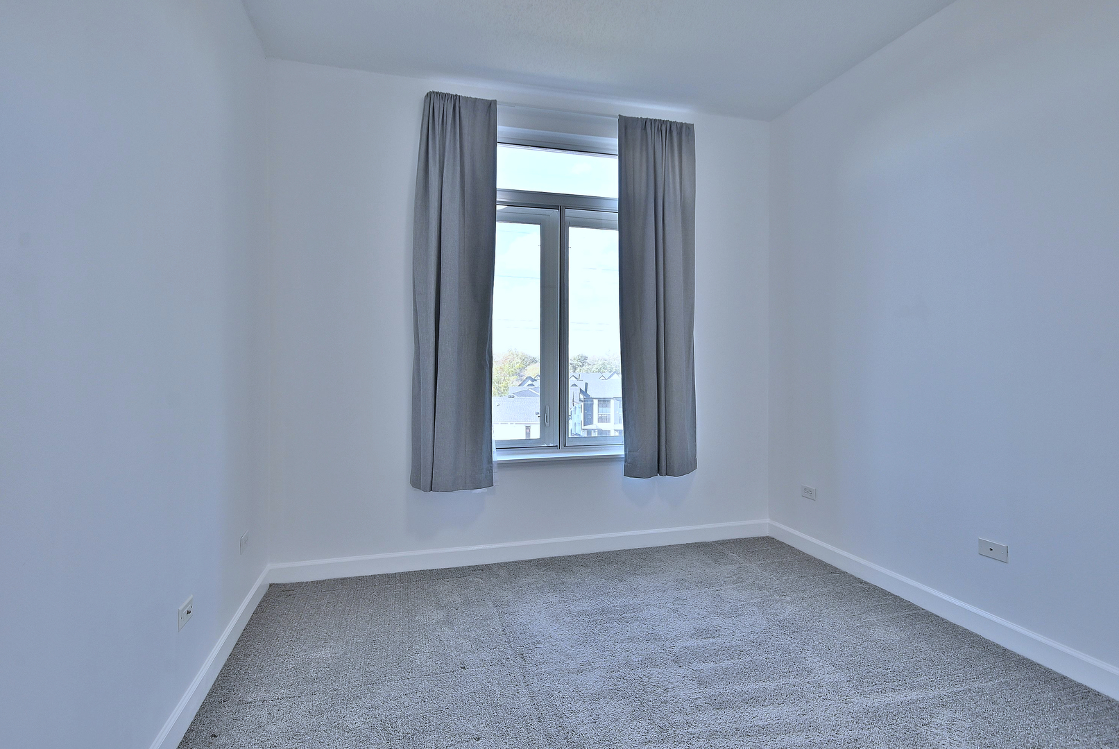 8300 Callie Avenue, Unit 412 Morton Grove, IL 60053 - Photo 20 of 28 an empty room with a window