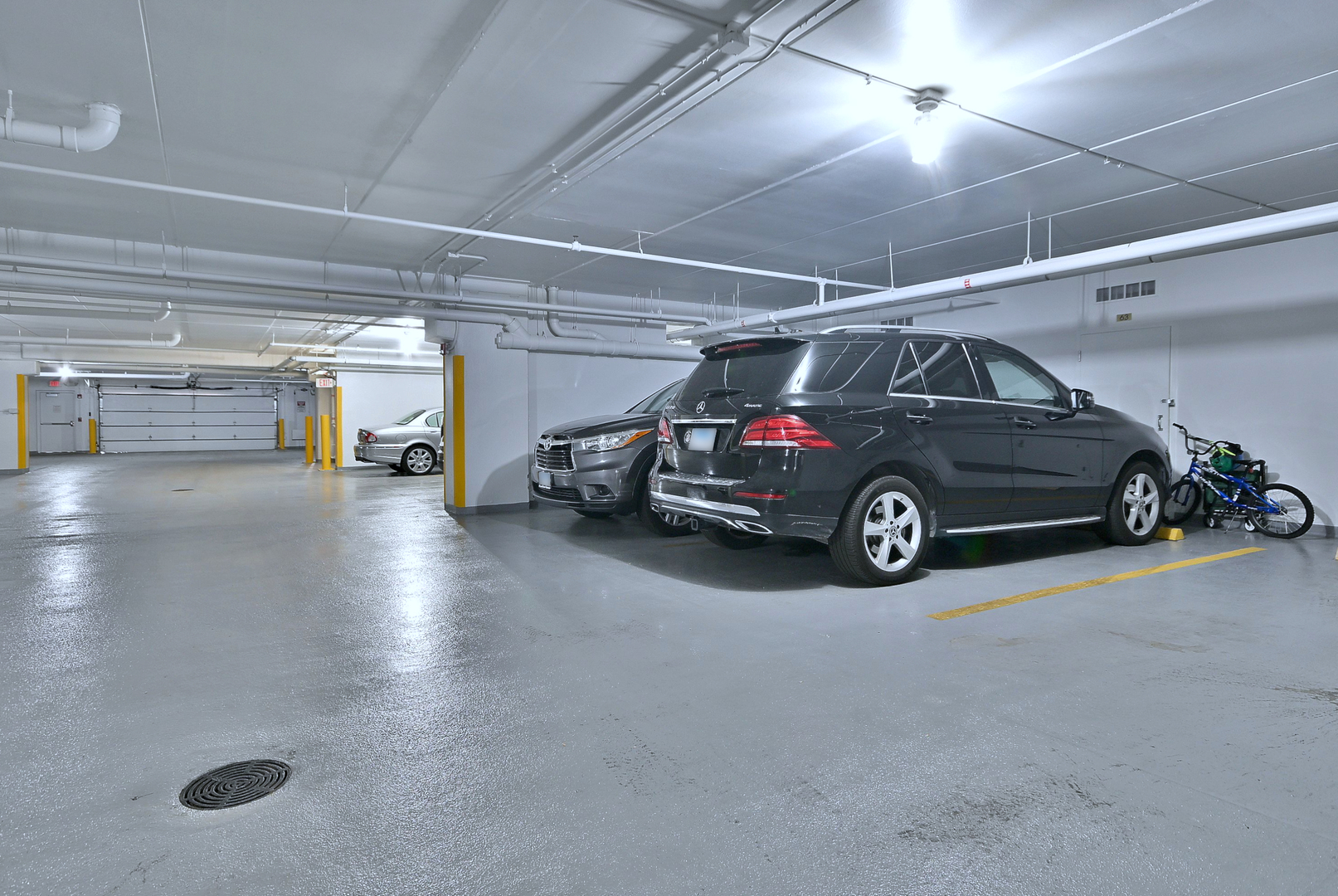 8300 Callie Avenue, Unit 412 Morton Grove, IL 60053 - Photo 25 of 28 a view of parking garage with cars parked