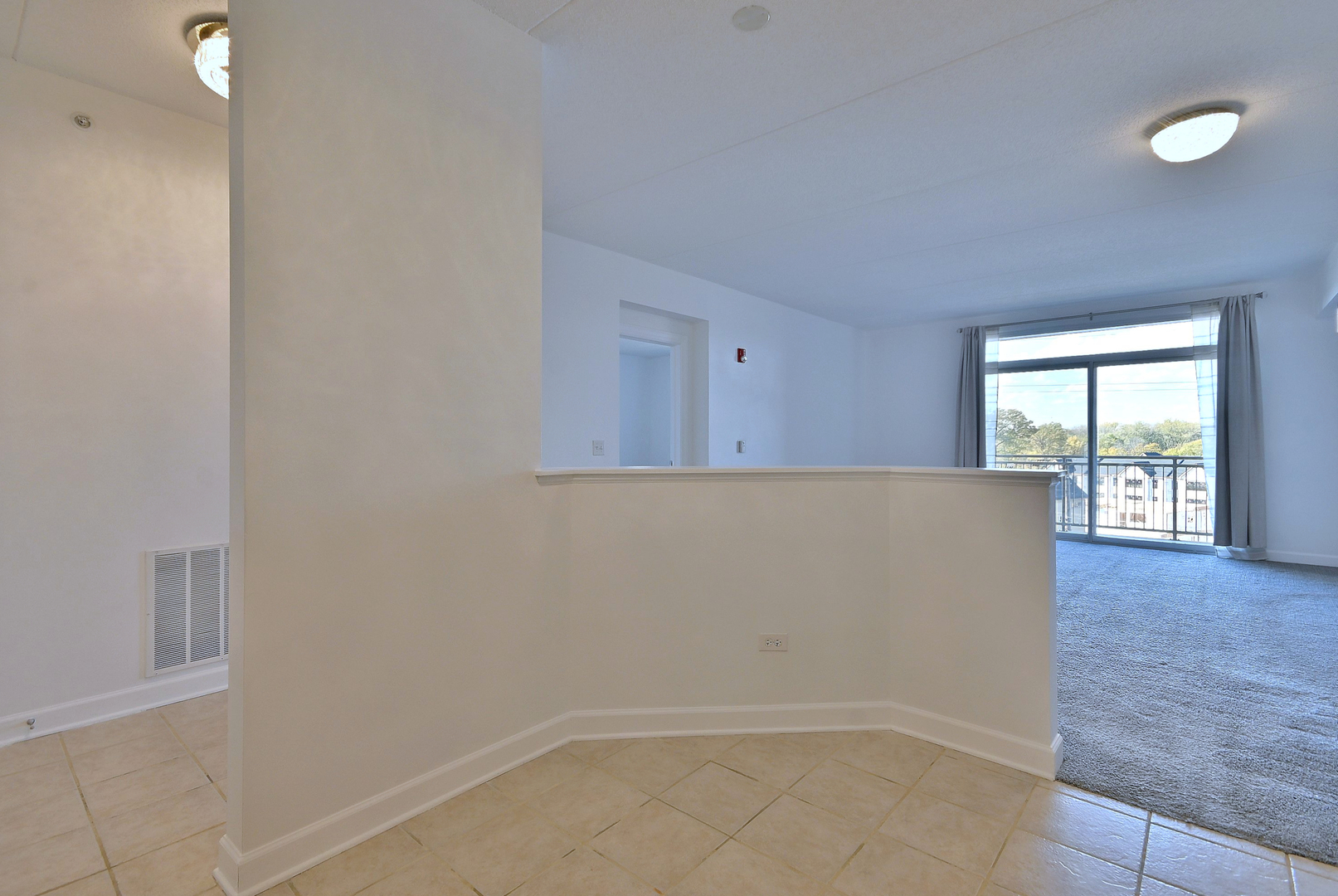 8300 Callie Avenue, Unit 412 Morton Grove, IL 60053 - Photo 8 of 28 a view of an empty room with a window