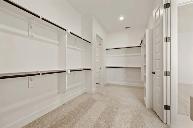 a spacious bathroom with a sink and a mirror