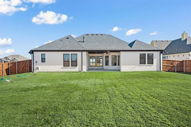 a view of an house with backyard and kitchen