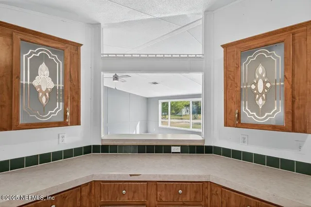 a kitchen with stainless steel appliances granite countertop a stove a sink dishwasher and a refrigerator