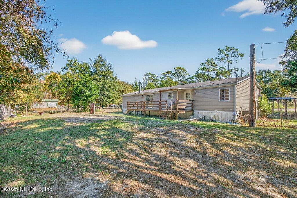 9899 Barber Loop Macclenny, FL 32063 - Photo 42 of 43 a view of a backyard with a garden