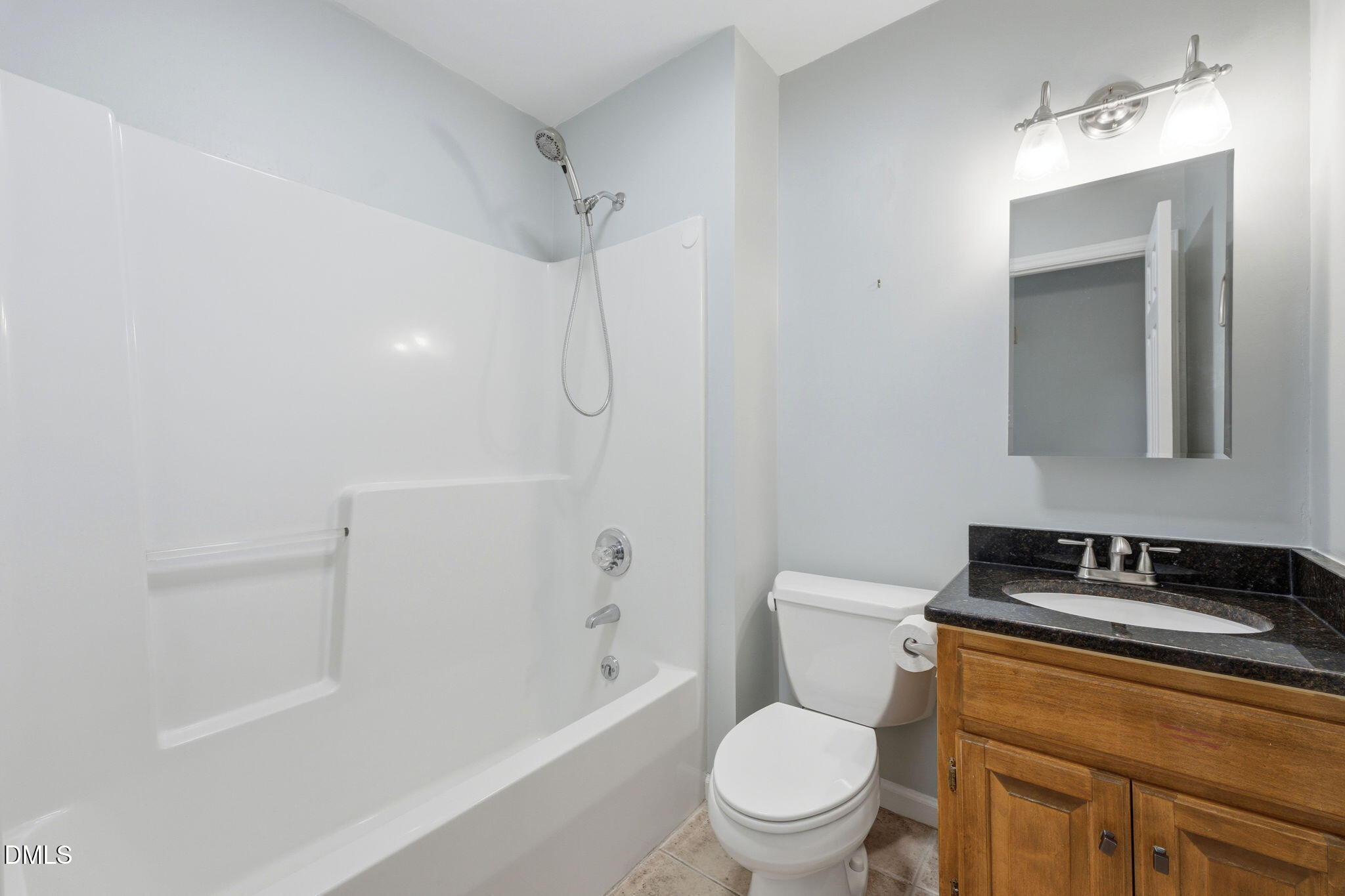 812 East Stagecoach Road Mebane, NC 27302 - Photo 12 of 25 a white toilet sitting next to a bath tub