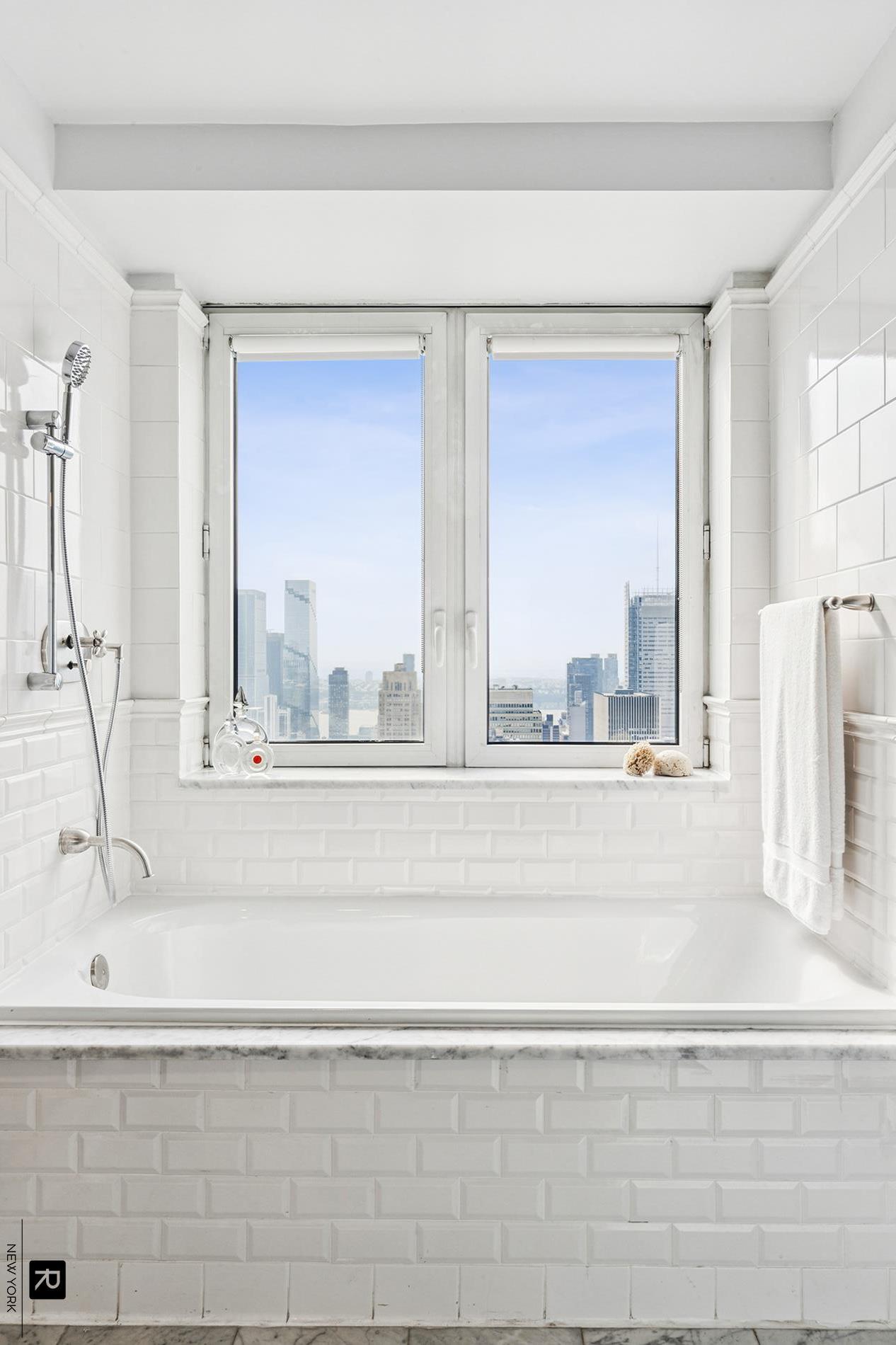 425 5th Avenue, Unit 65A Manhattan, NY 10016 - Photo 9 of 25 a view of a bathroom sink and next to a window