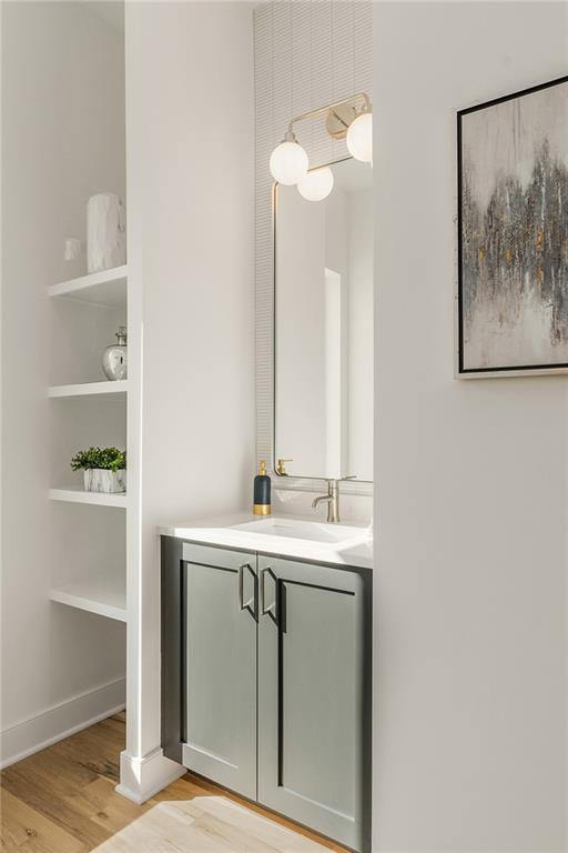 1237 Memorial Drive Southeast, Unit 403 Atlanta, GA 30316 - Photo 14 of 38 a bathroom with a sink and a mirror