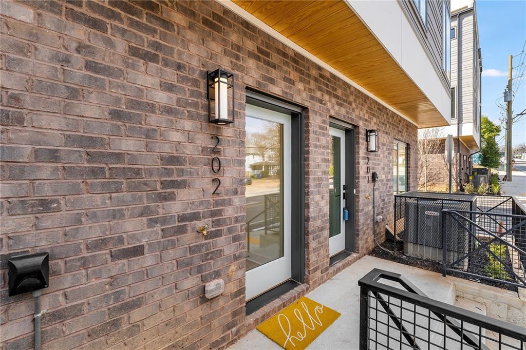 1237 Memorial Drive Southeast, Unit 403 Atlanta, GA 30316 - Photo 30 of 38 a view of a brick wall with a large window