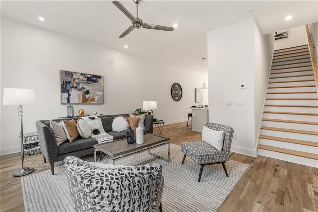 1237 Memorial Drive Southeast, Unit 403 Atlanta, GA 30316 - Photo 6 of 38 a living room with furniture and wooden floor